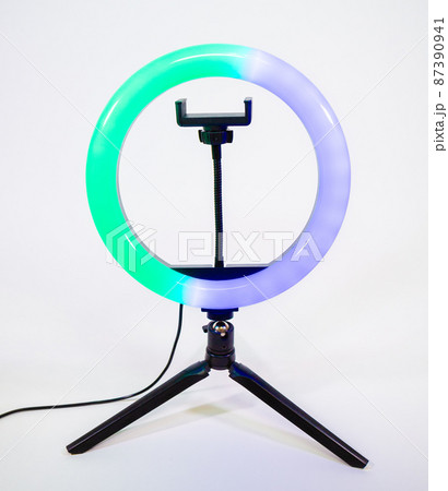 Ring lamp on a small tripod. Blue and green light. Ring lamp on a small tripod. Blue and green light. 87390941