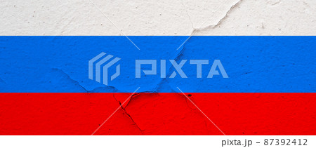 Russian flag on concrete texture background with cracks Russian flag on concrete texture background with cracks 87392412
