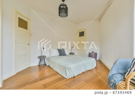 Practical bedroom with large mattress and soft pillows 87393469