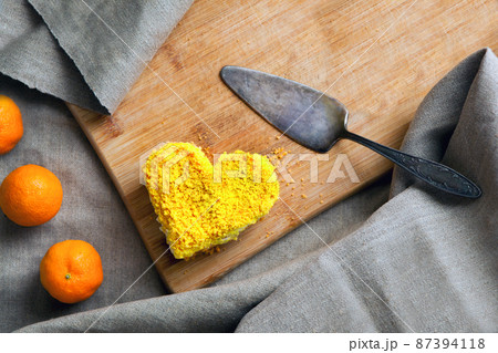 yellow cake heart shaped. Delicate dessert combines juicy tropical aromas of mango and passion fruit 87394118