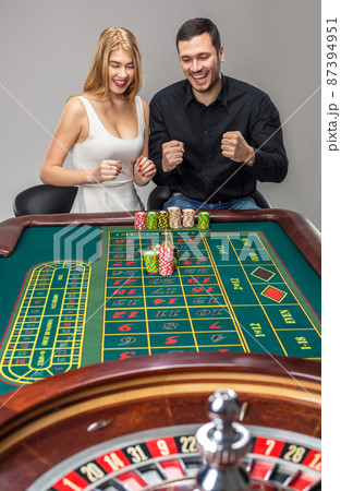 Couple playing roulette wins at the casino. Couple playing roulette wins at the casino. 87394951