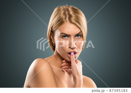 Portrait beautiful blond woman with long hair and blue eyes 87395183