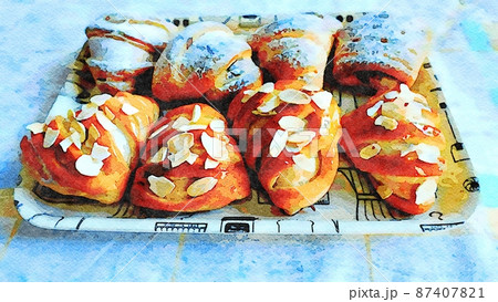 A small tray of sweets filled with custard with almonds and icing sugar on top. A small tray of sweets filled with custard with almonds and icing sugar on top. 87407821