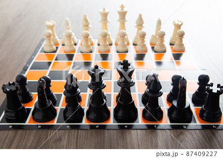 Chess board game on wooden table Chess board game on wooden table 87409227