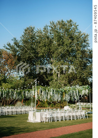 Banquet in the garden for a wedding Banquet in the garden for a wedding 87409545