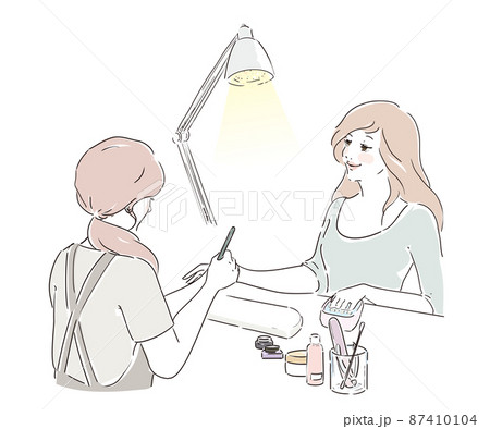 ネイルサロンで施術を受けるかわいい女性 甘皮処理 ネイルサロンで施術を受けるかわいい女性 甘皮処理 87410104