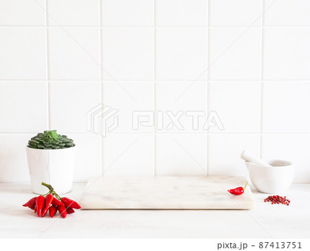 White kitchen countertop with white tiles, marble board for product presentation or advertising 87413751