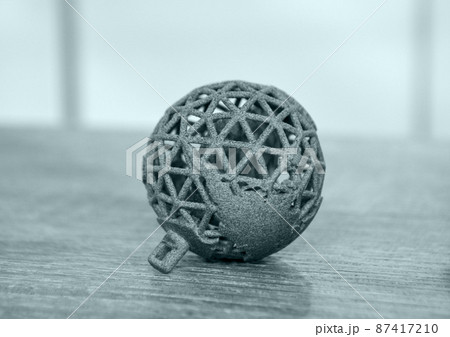 Gray object printed on powder 3D printer. Multi Jet Fusion MJF Powder 3D printer Gray object printed on powder 3D printer. Multi Jet Fusion MJF Powder 3D printer 87417210