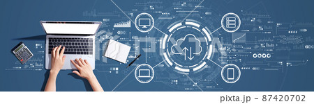 Cloud computing with person using a laptop Cloud computing with person using a laptop 87420702