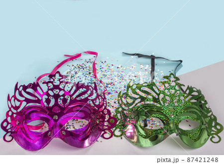 Happy Purim Multicolored Carnival Mask and stars on a blue and white background. Happy Purim Multicolored Carnival Mask and stars on a blue and white background. 87421248