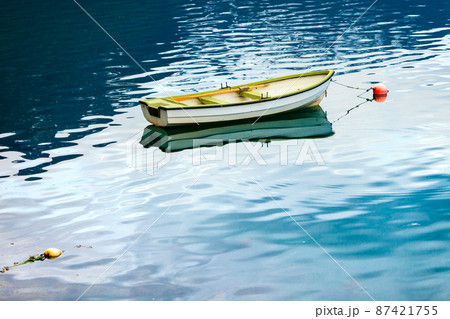 Little boat on water surface Little boat on water surface 87421755