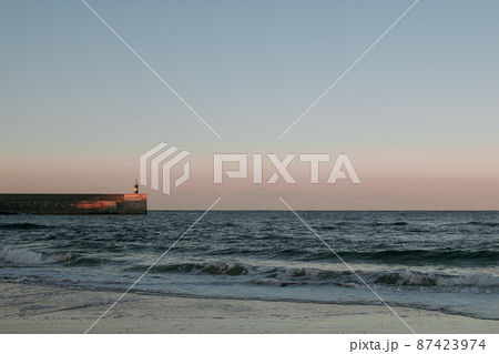 Beautiful view to the lighthouse at sunset, Cantabria, Spain. Beautiful view to the lighthouse at sunset, Cantabria, Spain. 87423974