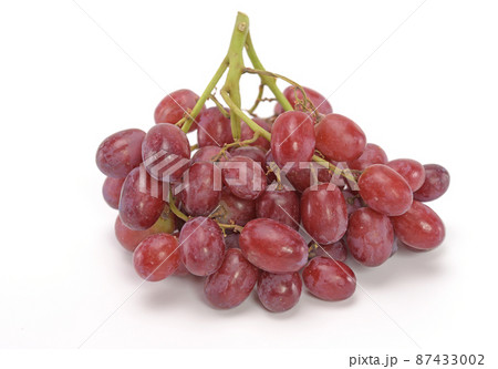 Ripe red grape. Bunch of red grape isolated on white background. Ripe red grape. Bunch of red grape isolated on white background. 87433002