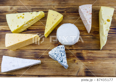 Set of various types of cheese on wooden table. Top view 87435177