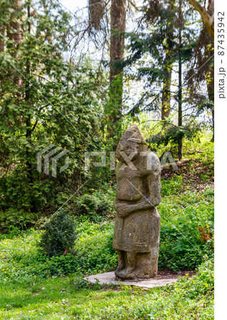 Ancient stone statue of the scythian warrior  in the Krasnokutsk park, Kharkiv region, Ukraine 87435942