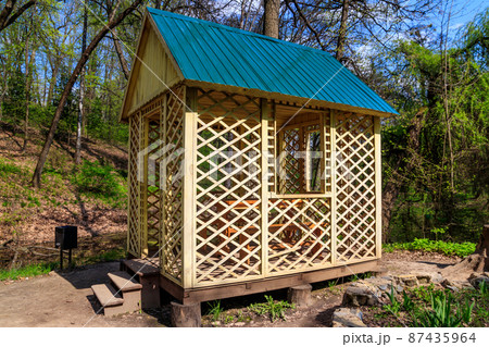 Small wooden gazebo in the Krasnokutsk park, Kharkiv region, Ukraine 87435964
