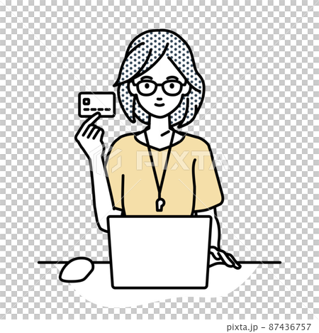 A teacher woman sitting at a desk and using a PC while holding a credit card 87436757