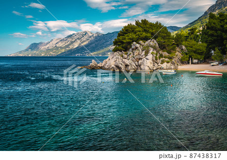 Moored motorboats in the amazing bay in Brela, Dalmatia, Croatia Moored motorboats in the amazing bay in Brela, Dalmatia, Croatia 87438317
