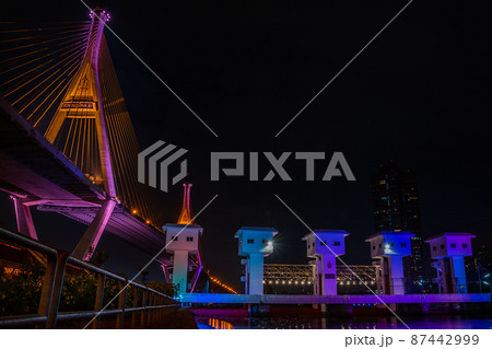 Bhumibol Bridge also casually call as Industrial Ring Road Bridge with floodgate illuminate with spotlight at night scene, Samut Prakarn, Thailand Bhumibol Bridge also casually call as Industrial Ring Road Bridge with floodgate illuminate with spotlight at night scene, Samut Prakarn, Thailand 87442999