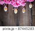 Floral Easter wooden planks background. 87445283