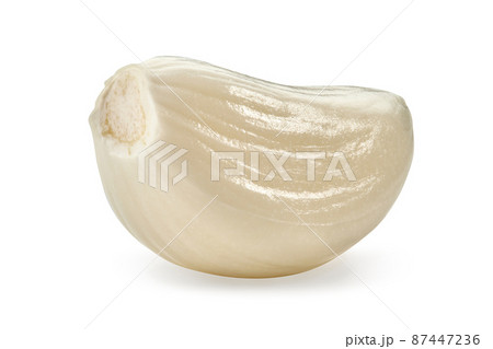 Macro shot of one fresh, peeled garlic segment, isolated on white background. Vegetable, spice. Summer harvest. Close up, copy space Macro shot of one fresh, peeled garlic segment, isolated on white background. Vegetable, spice. Summer harvest. Close up, copy space 87447236