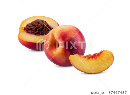 Smooth-skinned whole nectarine, one half with kernel and one unpitted slice isolated on white background with copy space for text, images. Close-up. Smooth-skinned whole nectarine, one half with kernel and one unpitted slice isolated on white background with copy space for text, images. Close-up. 87447487