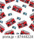 An analog portable tape recorder and audio cassette on a white background. 87448228