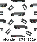 An analog VCR and videotape on a white background. 87448229