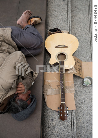 Top view of old beggar man sleep in city at winter 87448438