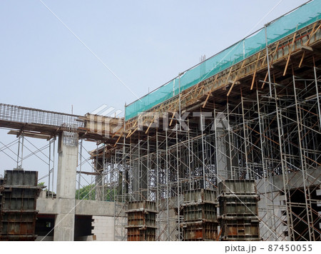 KUALA LUMPUR, MALAYSIA - JULY 7, 2021: Beam and column formwork installed at a construction site. Molds are made of wood and plywood. Be the basis of form to reinforced concrete. 87450055