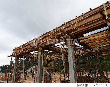KUALA LUMPUR, MALAYSIA - JULY 7, 2021: Beam and column formwork installed at a construction site. Molds are made of wood and plywood. Be the basis of form to reinforced concrete. 87450061