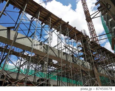 KUALA LUMPUR, MALAYSIA - JULY 7, 2021: Beam and column formwork installed at a construction site. Molds are made of wood and plywood. Be the basis of form to reinforced concrete. KUALA LUMPUR, MALAYSIA - JULY 7, 2021: Beam and column formwork installed at a construction site. Molds are made of wood and plywood. Be the basis of form to reinforced concrete. 87450079