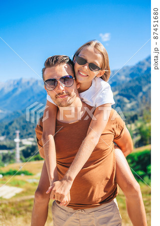 Beautiful happy family in mountains in the background of fog 87451680