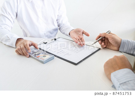 Dishonest cheating in business illegal money, Businessman giving bribe money in business people to accept agreement contract of investment deal, Bribery and corruption concept 87451753