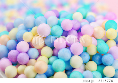 Foam beads of various colors brightly colored background. Foam beads of various colors brightly colored background. 87457781