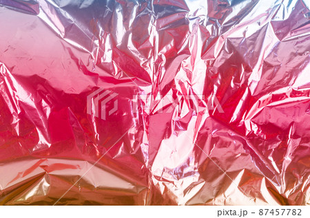Colourful foil background with shiny crumpled surface for background. Colourful foil background with shiny crumpled surface for background. 87457782