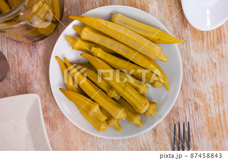 Pile of pickled okra served on table 87458843