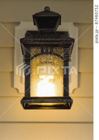 Electric lamp hanging on porch Electric lamp hanging on porch 87460752