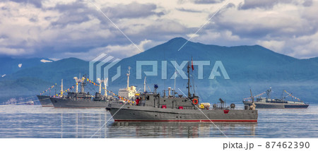 Warships in the maritime parade on bay on Pacific ocean in Kamchatka Peninsula 87462390