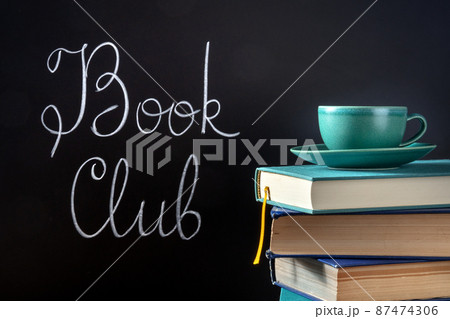 Book Club Concept. A stack of hardcover books with chalk lettering Book Club Concept. A stack of hardcover books with chalk lettering 87474306