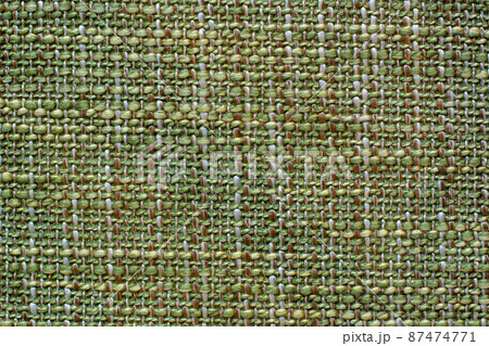 Color fabric texture. Woolen soft crumpled fabric of a green shade. Copy space. 87474771