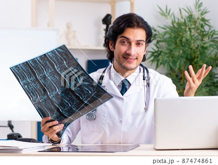 The young handsome doctor radiologist working in the clinic The young handsome doctor radiologist working in the clinic 87474861