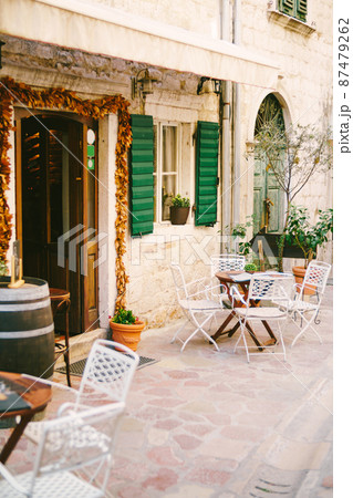 Wooden tables near the walls of a rustic cafe 87479262