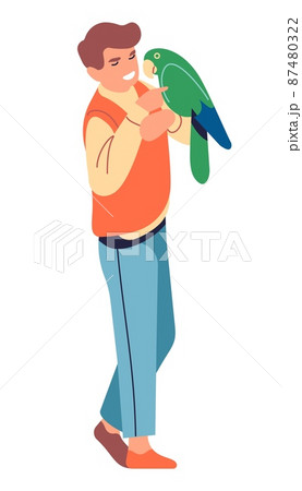 Man holding big green parrot. Guy talking with bird 87480322