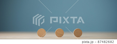 Three blank wooden cut circles placed in a row 87482682