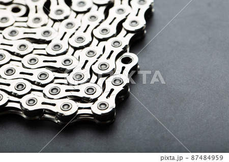 Shiny mountain bike chain on dark background 87484959