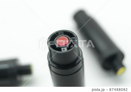 Aerosol pepper cartridges for a protective gun. Means of self-defense against attacks by aggressive people and animals. Selective focus, isolated on white, copy space Aerosol pepper cartridges for a protective gun. Means of self-defense against attacks by aggressive people and animals. Selective focus, isolated on white, copy space 87488082