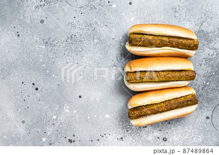 Vegan hot dog with meatless Vegetarian sausage. Gray background. Top view. Copy space Vegan hot dog with meatless Vegetarian sausage. Gray background. Top view. Copy space 87489864