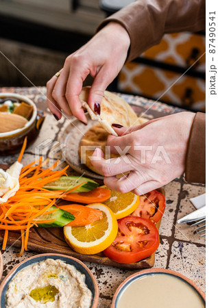 Women eating Traditional Turkish Village Breakfast served in restaurant. Top view 87490541