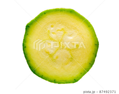 cut a thin slice of zucchini, isolated on white background 87492371
